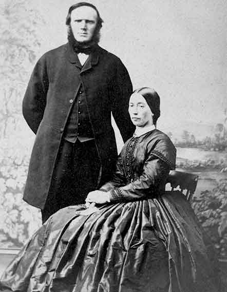 1800's Professional Studio Photograph Couple Man Standing With Chin Strap Beard Woman Sitting Hoop Skirt Dress