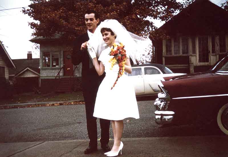 1963 Wedding Couple Celebrate On New Westminster Street Groom Bride Short Wedding Dress Vintage Cars Houses
