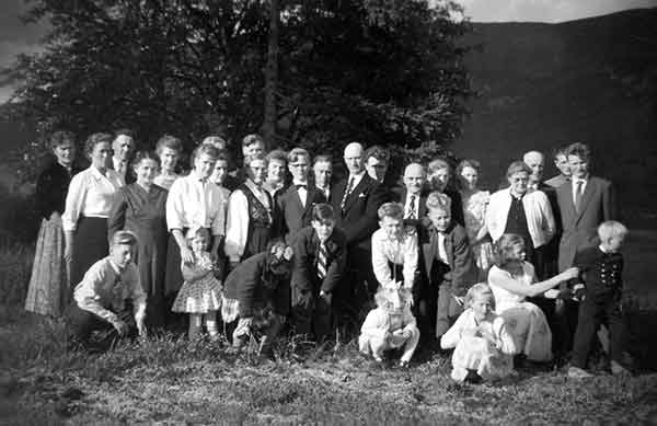 1950's Family Reunion Celebration 32 Children Parents Grandparents Standing Outside In Norway Country Setting Overlooking Valley