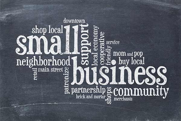 Montage Of Small Business Buy Local Words On Artistic Black Board Promoting Healthy Local Vibrant Economy